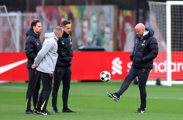 Arne Slot plays with a ball in Liverpool team training.