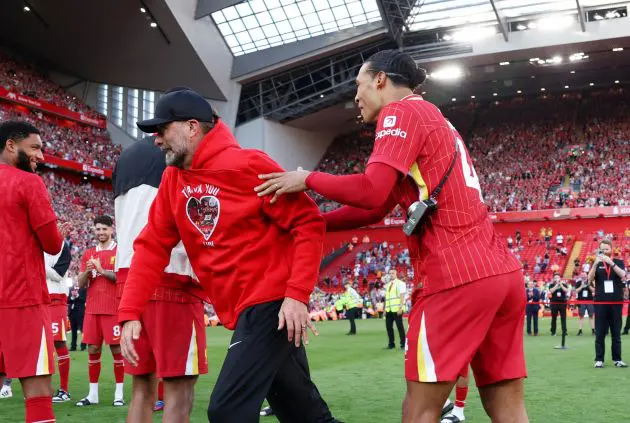 Virgil van Dijk grabs Jurgen Klopp.