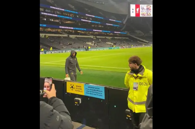 Trent Alexander-Arnold walks along the touchline in front of Liverpool fans in London.
