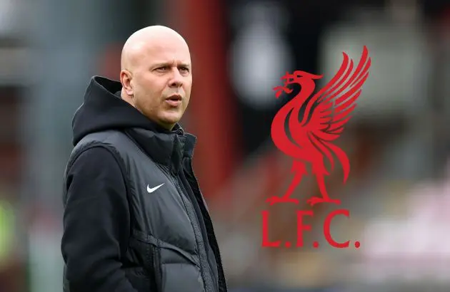 Liverpool head coach Arne Slot looks at the club crest.