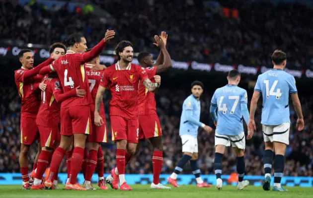 Liverpool players celebrate scoring against Manchester City