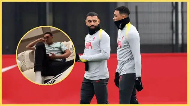 Mo Salah and Trent Alexander-Arnold talk during Liverpool training next to picture of Trent at home.