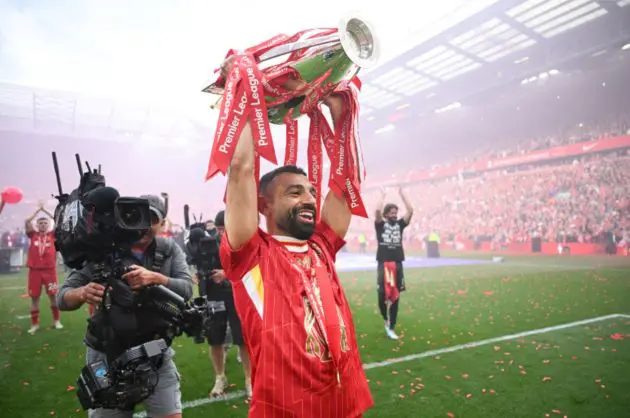 Mo Salah raises the Premier League trophy at Anfield