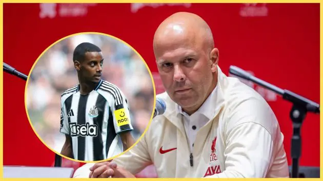 Arne Slot looks pensive during a press conference next to picture of Alexander Isak.