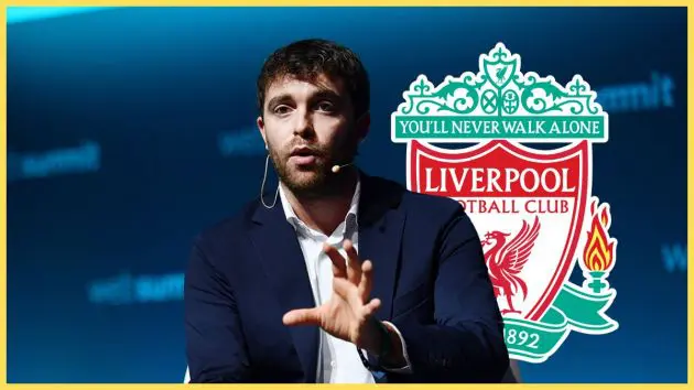 Fabrizio Romano holds out an open hand in front of Liverpool club crest.