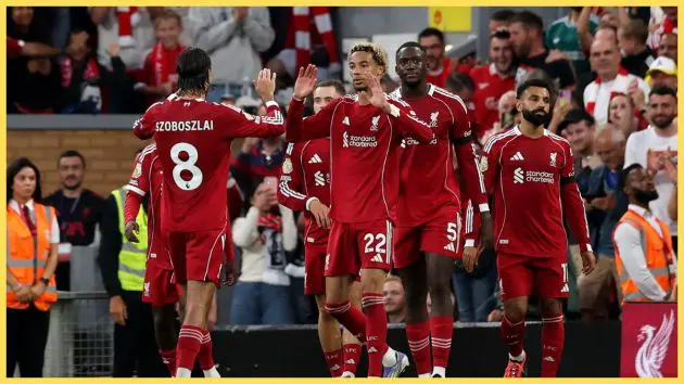 Hugo Ekitike high fives Liverpool teammates after scoring against Bournemouth.