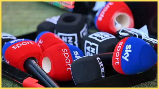 Several microphone covers from Sky Sports and DAZN lie next to each other.