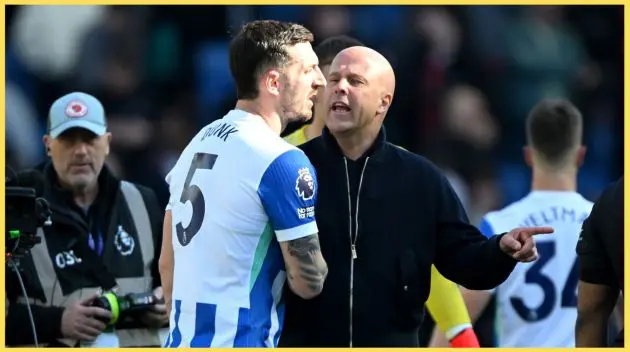 Arne Slot speaks to Lewis Dunk after Liverpool's defeat at Brighton