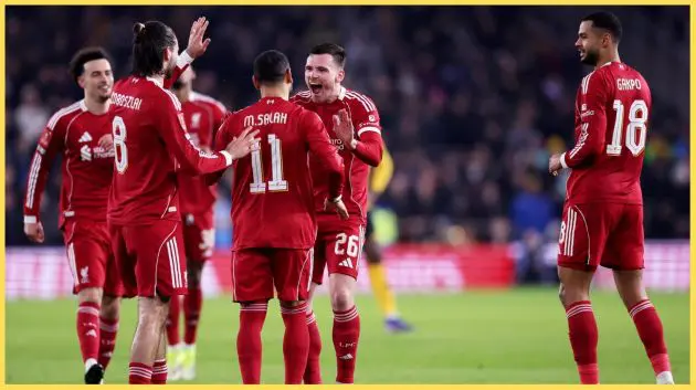 Liverpool players celebrate after scoring against Wolves