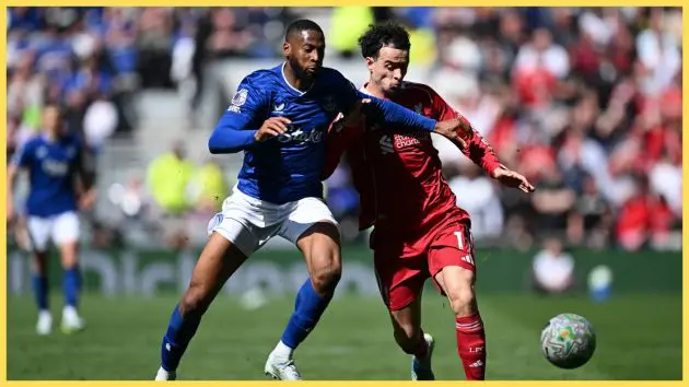 Curtis Jones of Liverpool is challenged by Beto of Everton during the Premier League match between Everton and Liverpool at Hill Dickinson Stadium