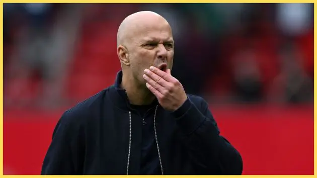 Arne Slot rubs his face in anguish during Liverpool game.