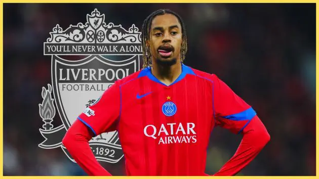 PSG's Bradley Barcola puts his hands on his hips in frustration in front of Liverpool club crest.