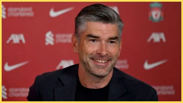 Liverpool sporting director Richard Hughes smiles during press conference.