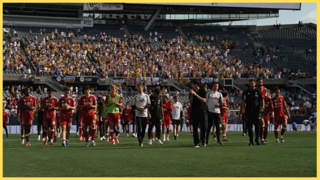 Liverpool players and coaches undergo a lap of appreciation after the friendly against Leeds